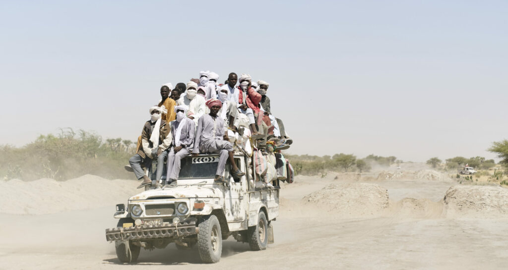 Chadian people carried across the desert on the way to Bol, in southern Chad on November 9, 2018.